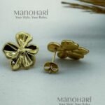 Aarini petal glow studs with elegant floral gold plated detailing