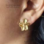 Aarini petal glow studs with elegant floral gold plated detailing