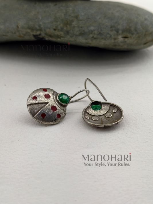 Aarini scarlet sparkle earrings with red crystal ladybug charm detailing