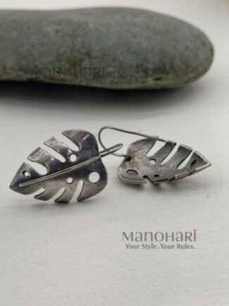 Meher leaf charm earrings with oxidised Monstera cutwork detailing