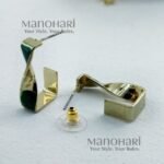 Aira twisted gold hoop earrings for women bold elegant statement jewellery