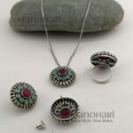 Aarini peacock heritage jewellery set with oxidized stone detailing