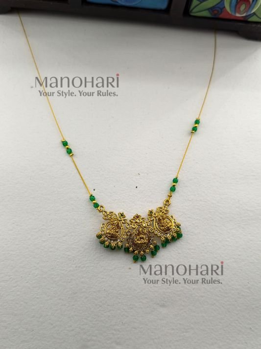 Aarini temple grace invisible necklace with Lakshmi green stone detailing