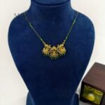 Aarini temple grace invisible necklace with Lakshmi green stone detailing