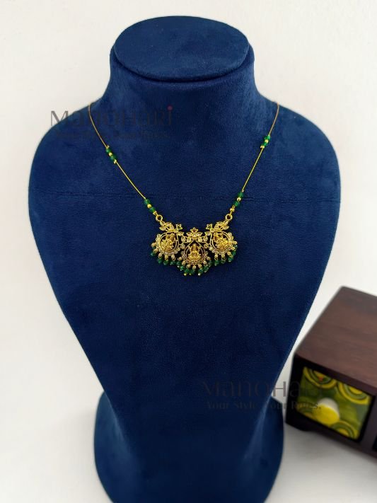 Aarini temple grace invisible necklace with Lakshmi green stone detailing