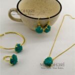 Meher crystal claw pendant set with golden polish detailing