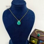 Meher crystal claw pendant set with golden polish detailing