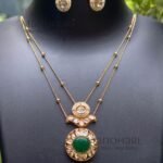 Aarini kundan royale pendant set with elegant gold stone detailing