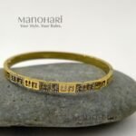 Ruhani Imperial Key Bangle featuring an iconic Greek Key meander pattern with a premium anti-tarnish finish and timeless geometric elegance
