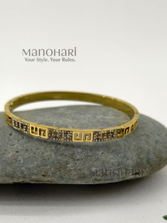 Ruhani Imperial Key Bangle featuring an iconic Greek Key meander pattern with a premium anti-tarnish finish and timeless geometric elegance
