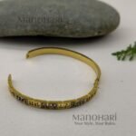 Ruhani Imperial Key Bangle featuring an iconic Greek Key meander pattern with a premium anti-tarnish finish and timeless geometric elegance
