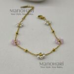 Aurelia Pearl Bloom Bracelet featuring lustrous pearl beads and delicate glass bead flowers in an elegant floral-inspired design