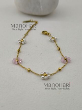 Aurelia Pearl Bloom Bracelet featuring lustrous pearl beads and delicate glass bead flowers in an elegant floral-inspired design