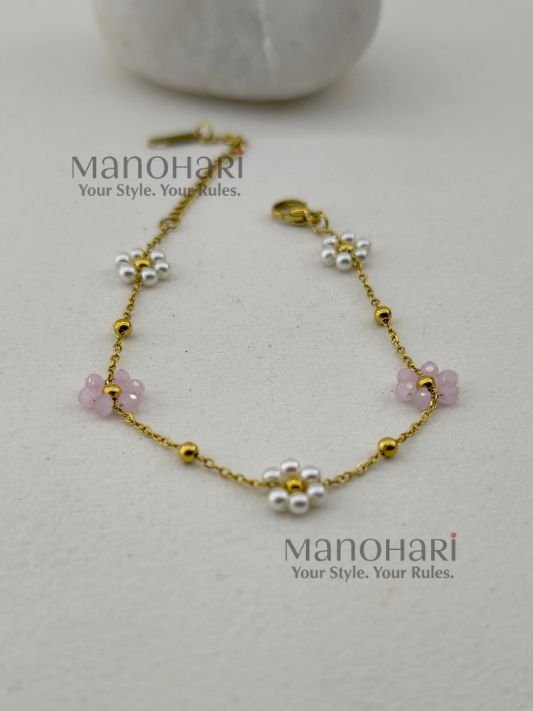Aurelia Pearl Bloom Bracelet featuring lustrous pearl beads and delicate glass bead flowers in an elegant floral-inspired design