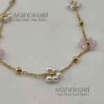 Aurelia Pearl Bloom Bracelet featuring lustrous pearl beads and delicate glass bead flowers in an elegant floral-inspired design