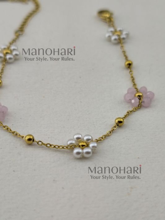 Aurelia Pearl Bloom Bracelet featuring lustrous pearl beads and delicate glass bead flowers in an elegant floral-inspired design