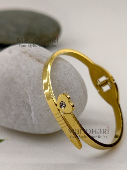 MN-BR-ATCB-AAR-01_1 Aarini Tiny Charm Bracelet for babies crafted in 18K gold-plated 316L stainless steel featuring a delicate openable bangle design
