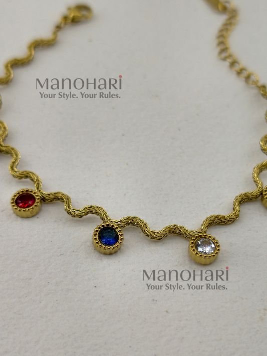 Aurelia WaveGlow Bracelet featuring an elegant wave-inspired design crafted in gold-plated stainless steel with a polished luxury finish