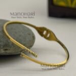 **Aurelia Crystal Bracelet crafted from premium 316L stainless steel with 18K gold plating, featuring an elegant openable design for women.**
