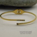 **Aurelia Crystal Bracelet crafted from premium 316L stainless steel with 18K gold plating, featuring an elegant openable design for women.**