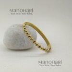 Meher Golden Grace Bracelet crafted in 18K gold-plated 316L stainless steel featuring a sleek and elegant bangle design