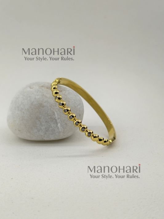 Meher Golden Grace Bracelet crafted in 18K gold-plated 316L stainless steel featuring a sleek and elegant bangle design