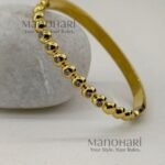 Meher Golden Grace Bracelet crafted in 18K gold-plated 316L stainless steel featuring a sleek and elegant bangle design