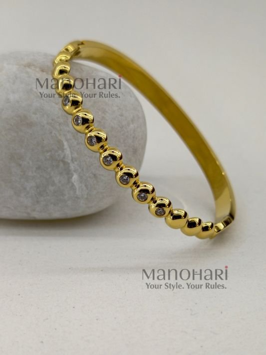 Meher Golden Grace Bracelet crafted in 18K gold-plated 316L stainless steel featuring a sleek and elegant bangle design