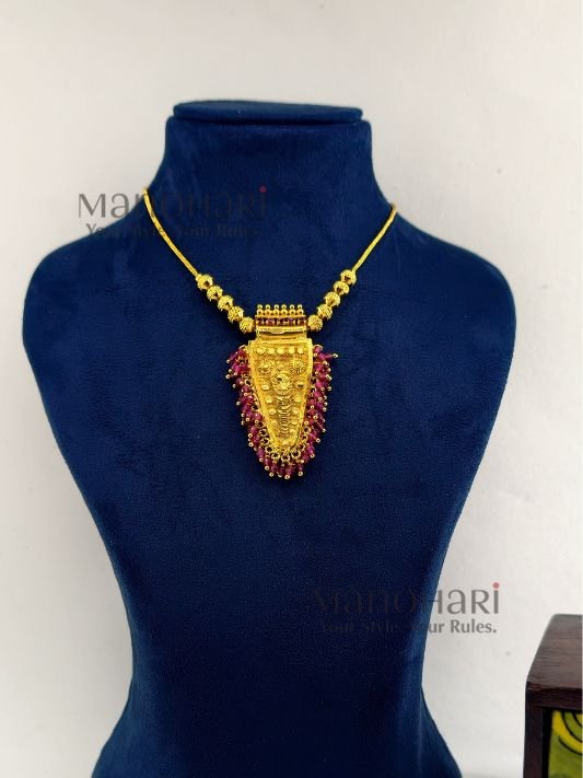 **Rangoli Nettipattam Heritage Chain in premium gold-plated finish with elegant seed bead detailing and traditional 6 cm pendant for women.**