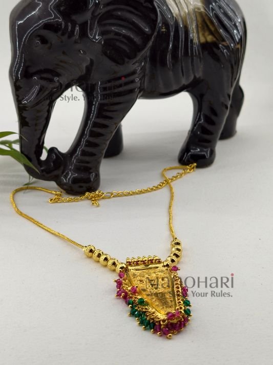 **Rangoli Nettipattam Heritage Chain in premium gold-plated finish with elegant seed bead detailing and traditional 6 cm pendant for women.**