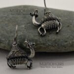 Aurelia Camel Caravan Earrings featuring an intricately detailed camel motif with an elegant oxidised silver finish inspired by Rajasthan heritage