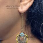 Aurelia Dual Radiance Drop Earrings featuring antique gold plating, intricate enamel detailing, and an elegant long hook design