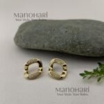 Aarini Noir Ivory Statement Earrings featuring a chic black-and-ivory geometric design with elegant modern styling