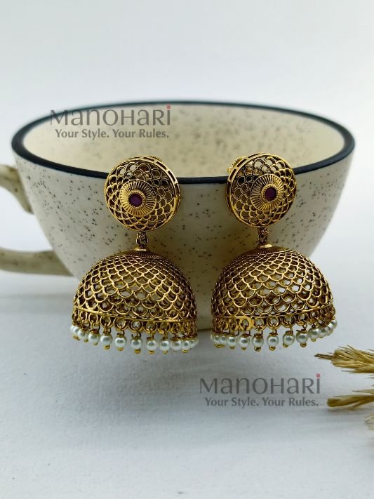 **Rajsi Antique Jhumka Earrings crafted from premium brass with a high gold polish, featuring an elegant 5 cm drop and traditional heritage design for women.**