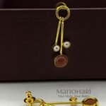 Aurelia Triple Pearl Drop Earrings featuring a minimalist stick design with elegant triple pearl accents