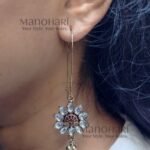 Aurelia White Blossom Drop Earrings featuring floral marquise-cut white stones in a radiant silver-tone finish with elegant long hooks