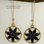 Meher Indigo Radiance Earrings featuring an indigo floral motif with a terracotta center framed within an elegant gold-tone circular design