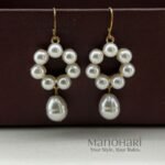 Meher pearl grace earrings featuring delicate floral detailing and elegant pearl drop accents