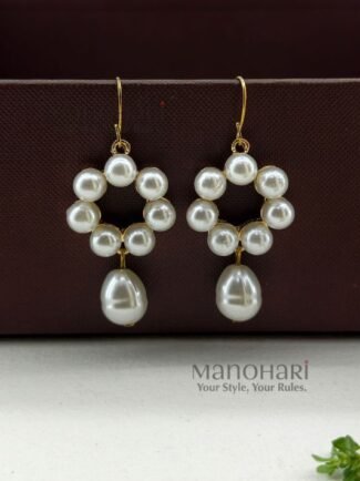 Meher pearl grace earrings featuring delicate floral detailing and elegant pearl drop accents