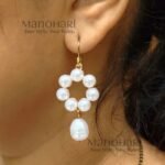 Meher pearl grace earrings featuring delicate floral detailing and elegant pearl drop accents