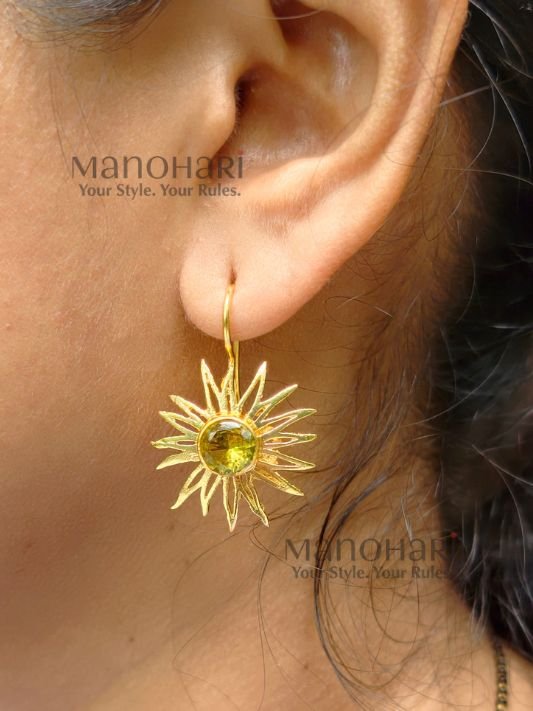 Meher Sunray Charm Hoops featuring a radiant sun-inspired charm crafted in raw brass with a classic hoop design