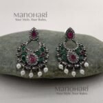Naina Celebration Glow Earrings featuring a vibrant multicolor design with an elegant oxidised silver finish and intricate statement dangler detailing