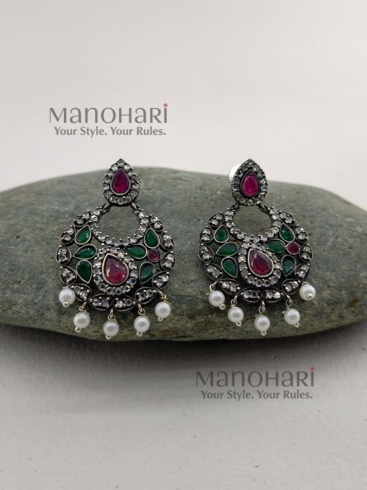 MN-ER-NCGE-NAI-01_2 Naina Celebration Glow Earrings featuring a vibrant multicolor design with an elegant oxidised silver finish and intricate statement dangler detailing