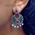 Naina Celebration Glow Earrings featuring a vibrant multicolor design with an elegant oxidised silver finish and intricate statement dangler detailing