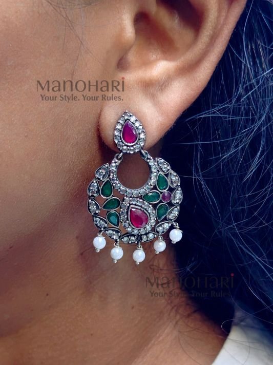 MN-ER-NCGE-NAI-01_3 Naina Celebration Glow Earrings featuring a vibrant multicolor design with an elegant oxidised silver finish and intricate statement dangler detailing