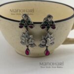Naina Mayura Grace Earrings featuring an intricate peacock motif with an elegant oxidised silver finish and traditional ethnic craftsmanship