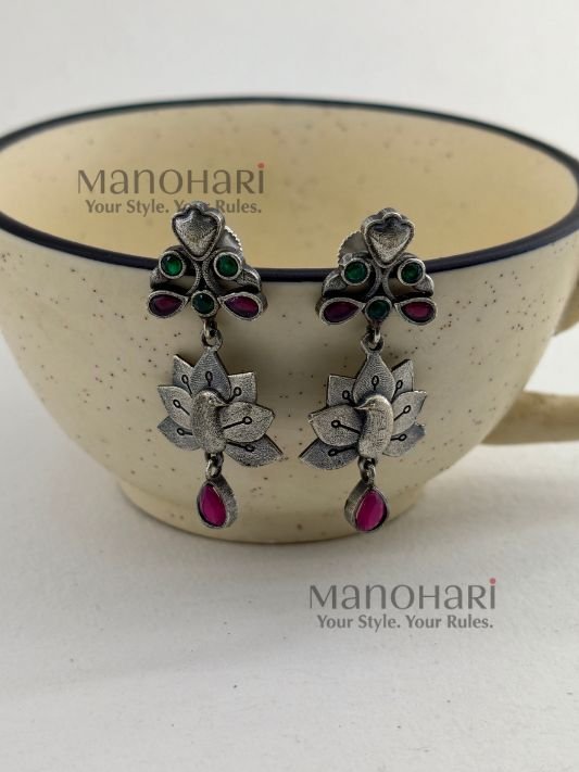 Naina Mayura Grace Earrings featuring an intricate peacock motif with an elegant oxidised silver finish and traditional ethnic craftsmanship