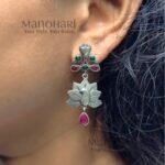 Naina Mayura Grace Earrings featuring an intricate peacock motif with an elegant oxidised silver finish and traditional ethnic craftsmanship