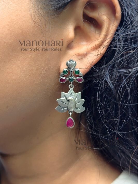 Naina Mayura Grace Earrings featuring an intricate peacock motif with an elegant oxidised silver finish and traditional ethnic craftsmanship