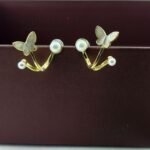 Naina Pearl Duo Earrings featuring a stylish two-piece pearl design with elegant detailing and a modern party-wear aesthetic